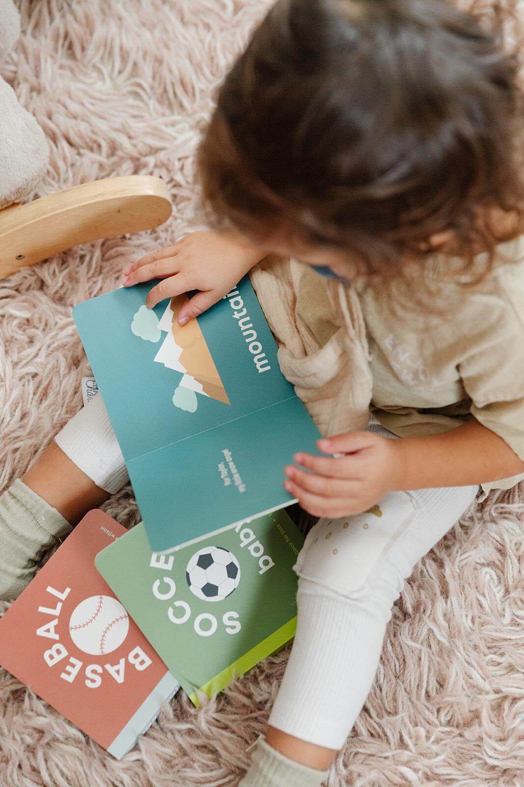 snowboarding baby book, baby snow book, winter sports baby book, baby ski book, toddler snowboard book, sports book for toddlers, sports book for babies, baby board book skiing, modern baby books, cute board books, baby shower gift, nursery decor, baby mountain book Edit alt text